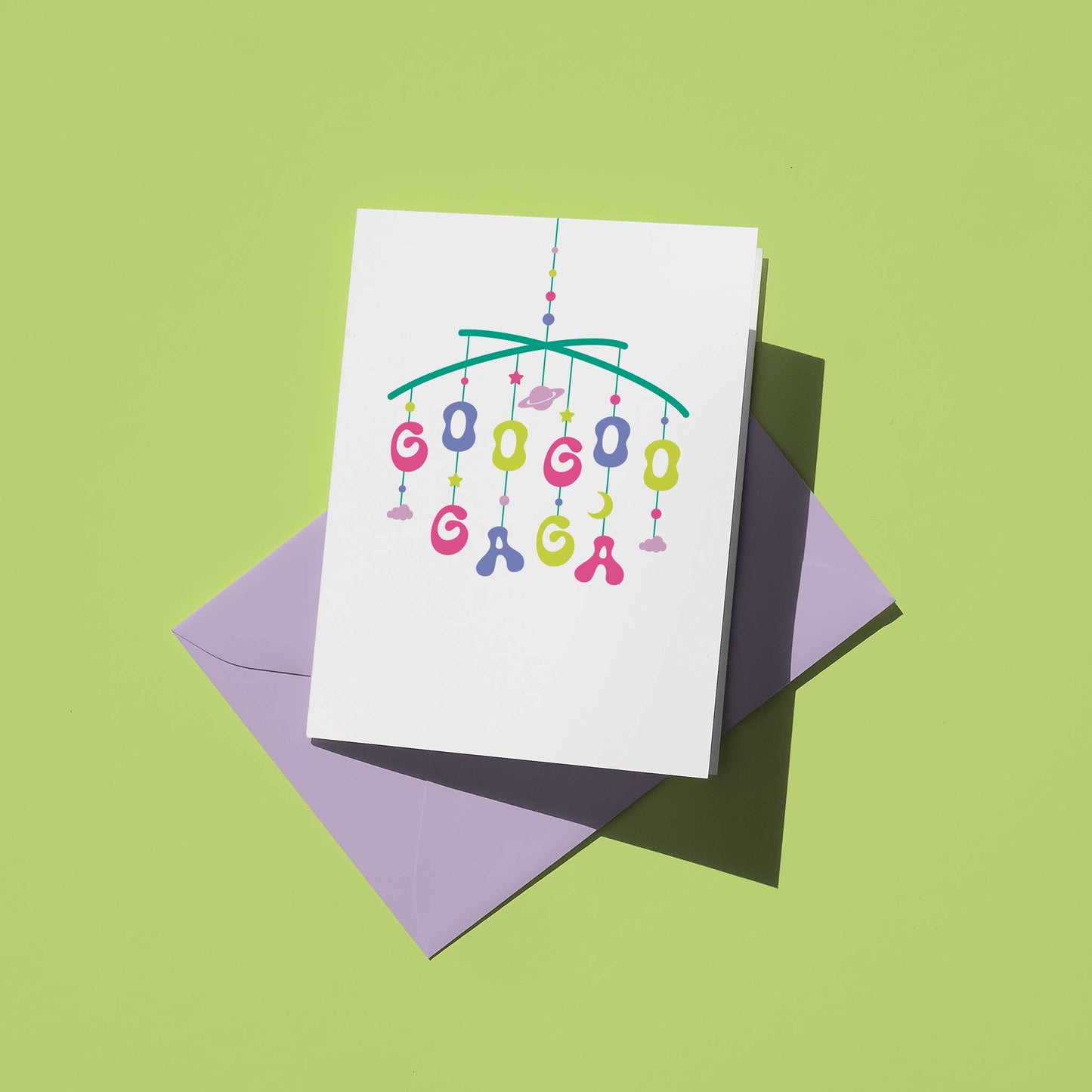 Greeting card with colorful baby mobile design on a green background