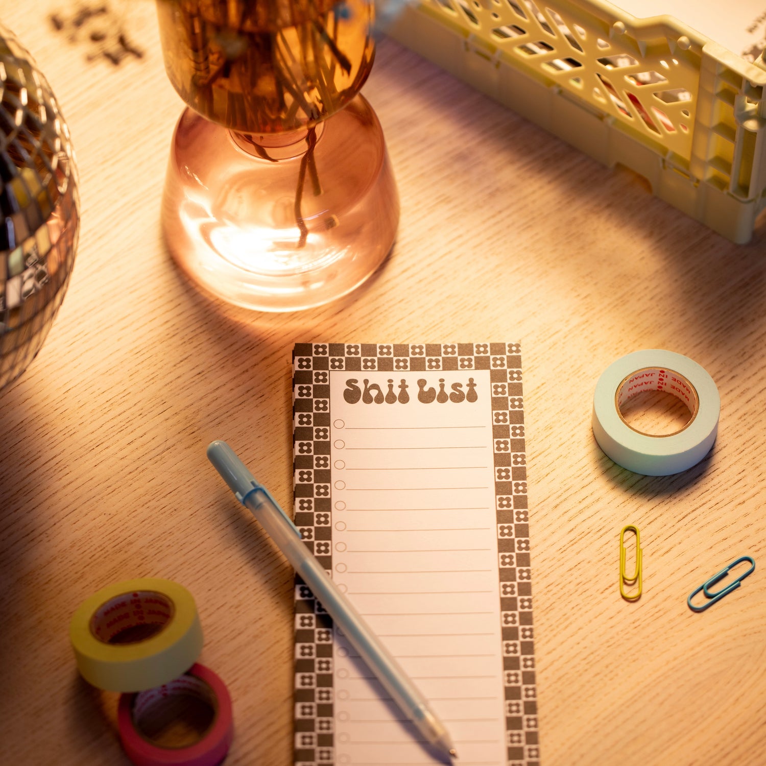 desk with notepad and stationery supplies