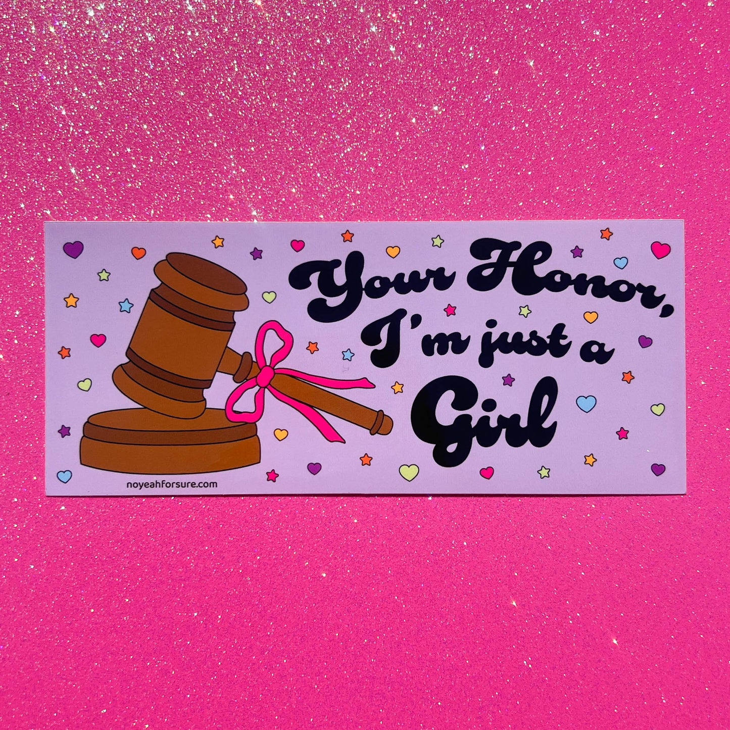 Sticker with a gavel and pink bow on a purple background with text 'Your Honor, I'm just a Girl' against a pink glittery background.