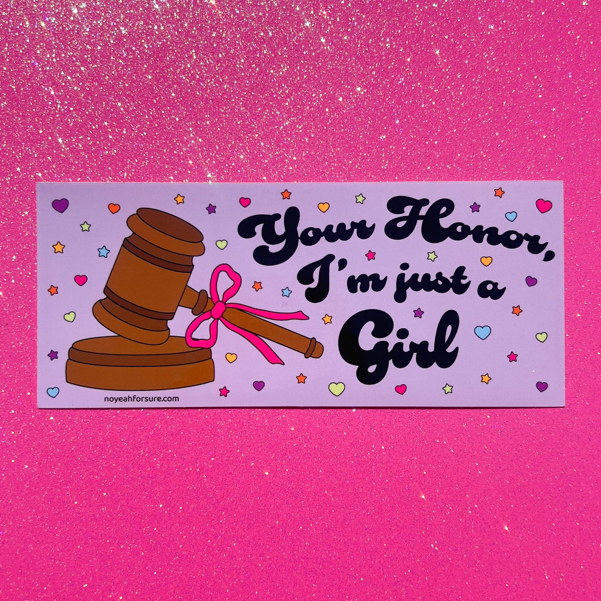 Sticker with a gavel and pink bow on a purple background with text 'Your Honor, I'm just a Girl' against a pink glittery background.