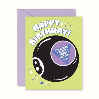 Birthday card with a black eight-ball design and humorous text on a green background