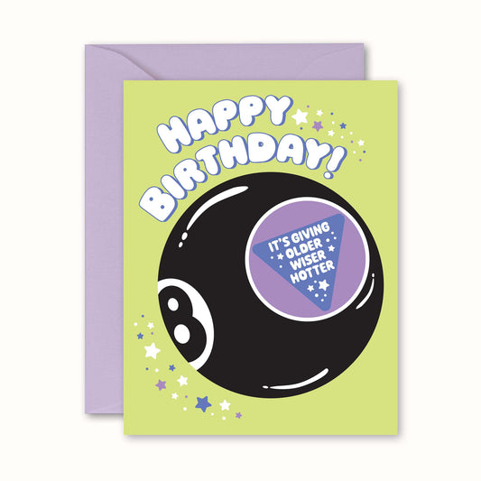 Birthday card with a black eight-ball design and humorous text on a green background