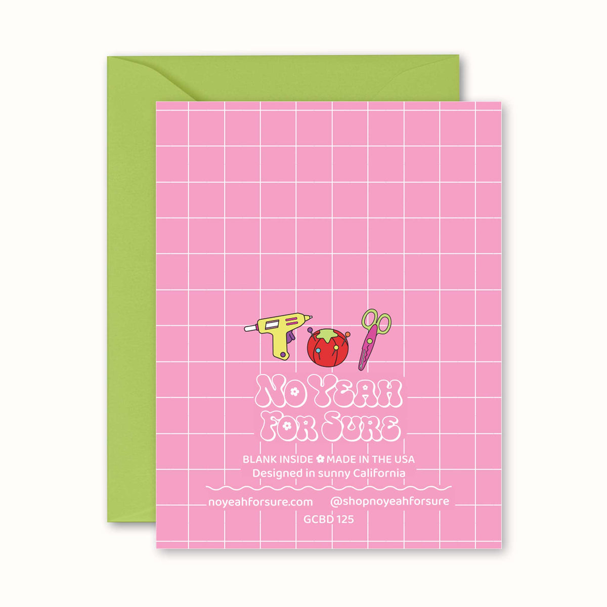 A pink greeting card with a white grid pattern and the text 'No Yeah For Sure' along with small craft-themed illustrations, shown with a light green envelope behind it on a white background.