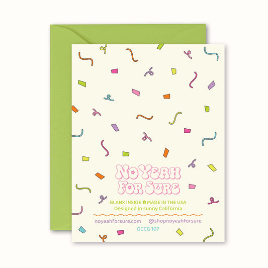 Greeting card with colorful confetti pattern and green envelope on a white background