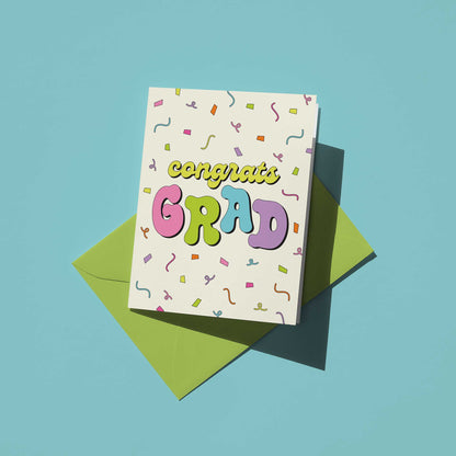 Graduation card with colorful text on a blue background