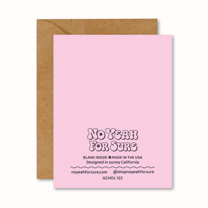Pink greeting card with text and a brown envelope on a white background