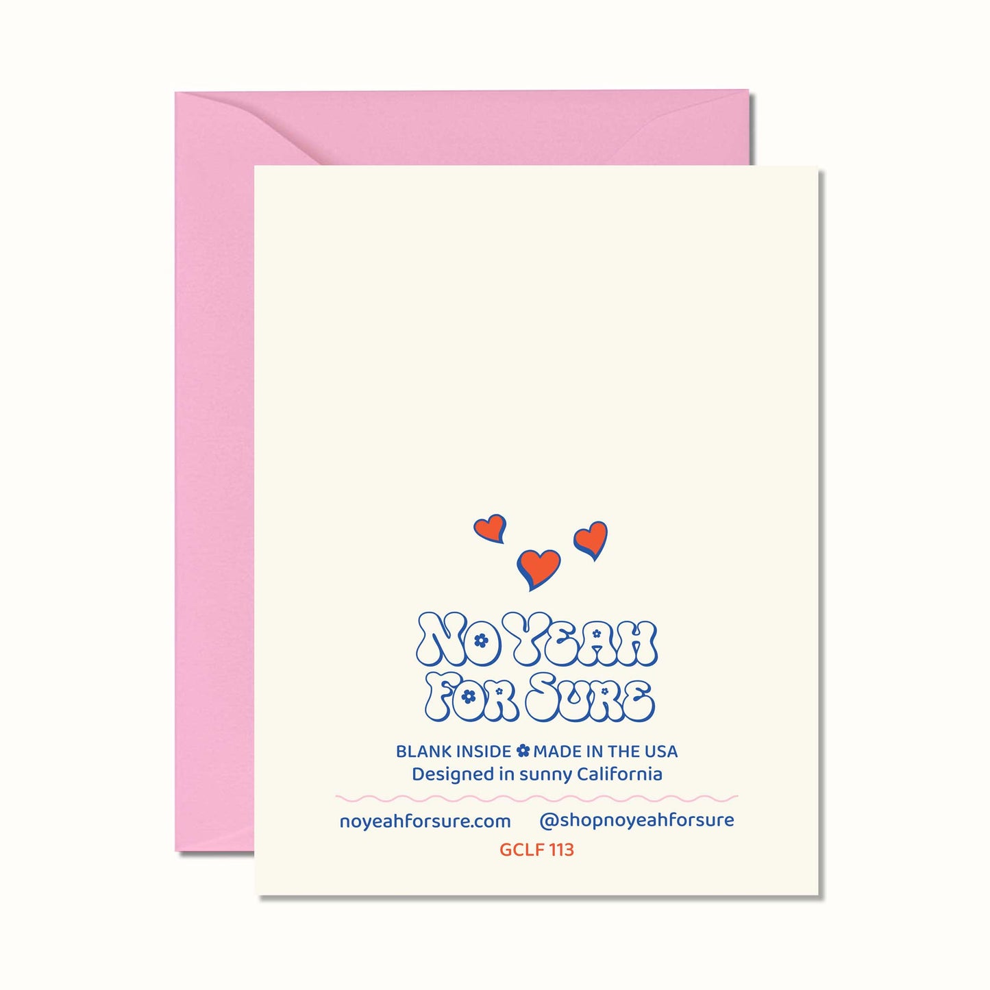 A cream-colored greeting card with a pink envelope behind it. The card features the text 'NO YEAH FOR SURE' in a blue bubbly font, with three small red hearts above it.
