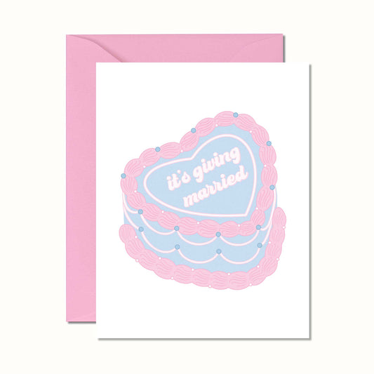 Greeting card with a cake illustration and text 'it's giving married' on a pink envelope.