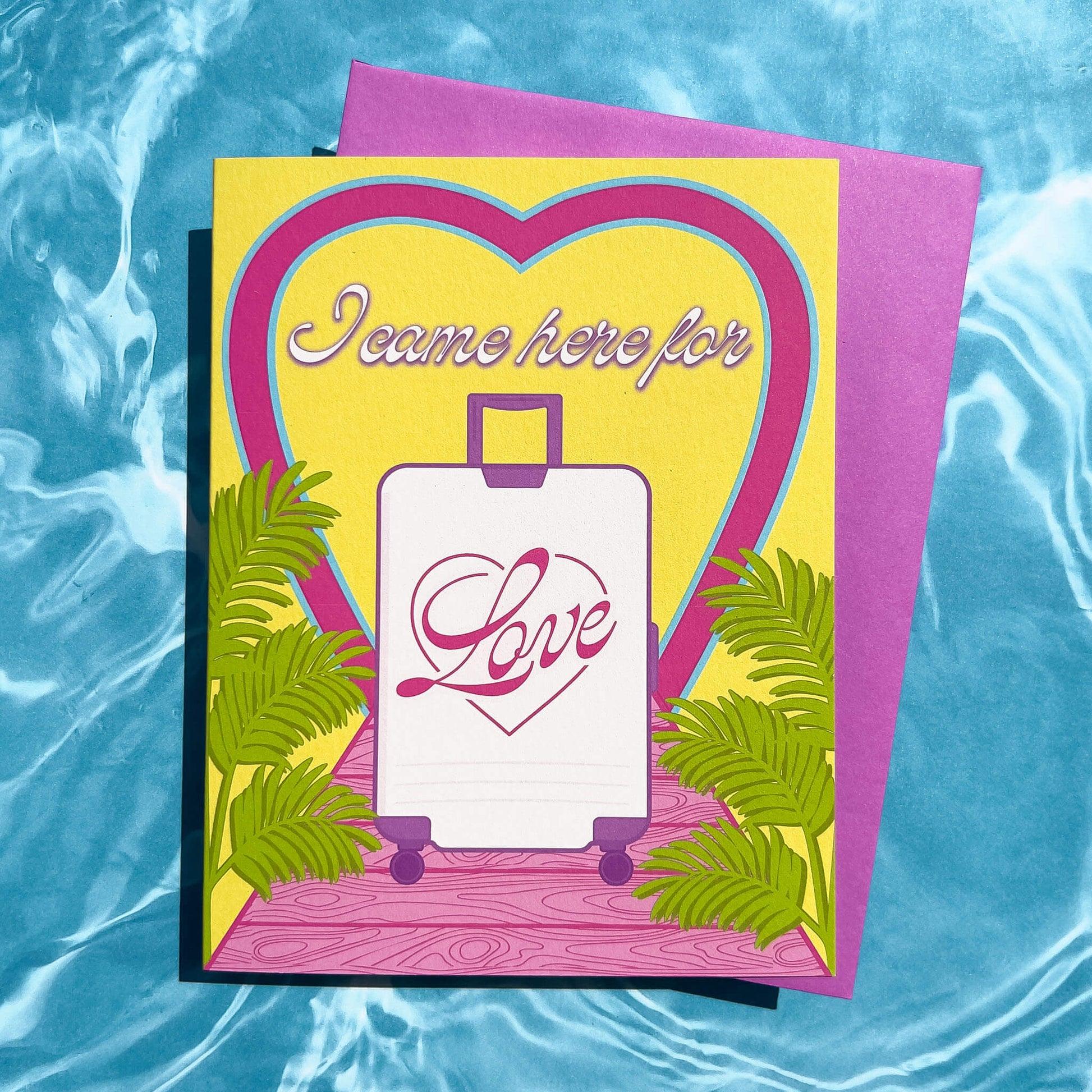 Greeting card with 'I came here for love' text and heart design on a blue water background
