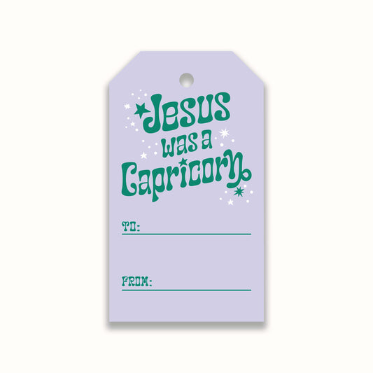 lilac christmas gift tag with graphic that reads "Jesus was a Capricorn"