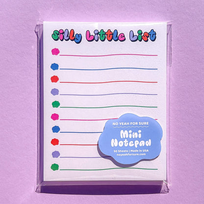 Mini notepad with colorful check boxes on a purple background