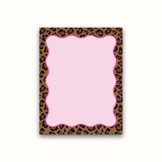 Notepad with pink center and leopard print border on a white background