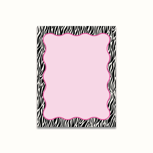 Notepad with zebra print border with a pink center on a white background