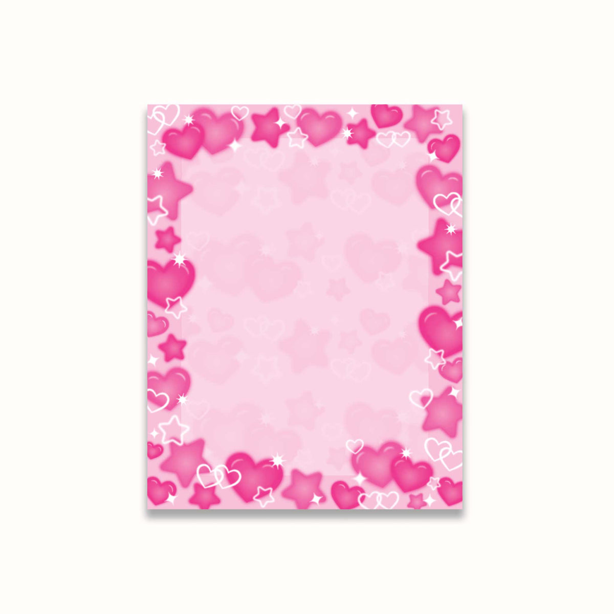 A notepad with a decorative border of airbrush hearts and stars in various shades of pink and white, set against a light off-white background.