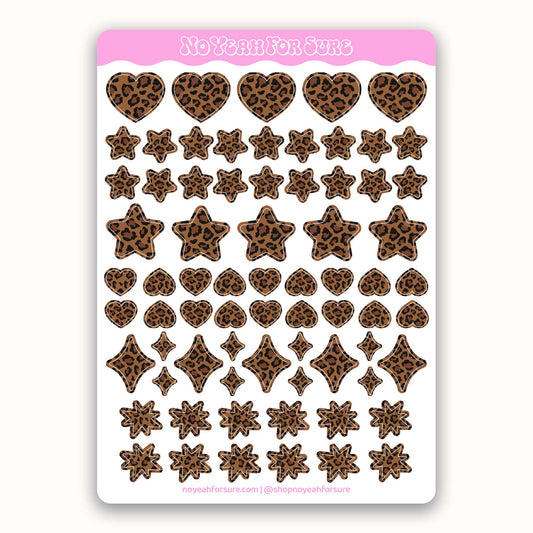 Sheet of heart and star shaped planner stickers with leopard print designs on a white background
