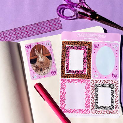 Pink animal print sticker frames displayed on an open notebook with a pink pen, purple scissors, and a pink ruler on a lavender background.