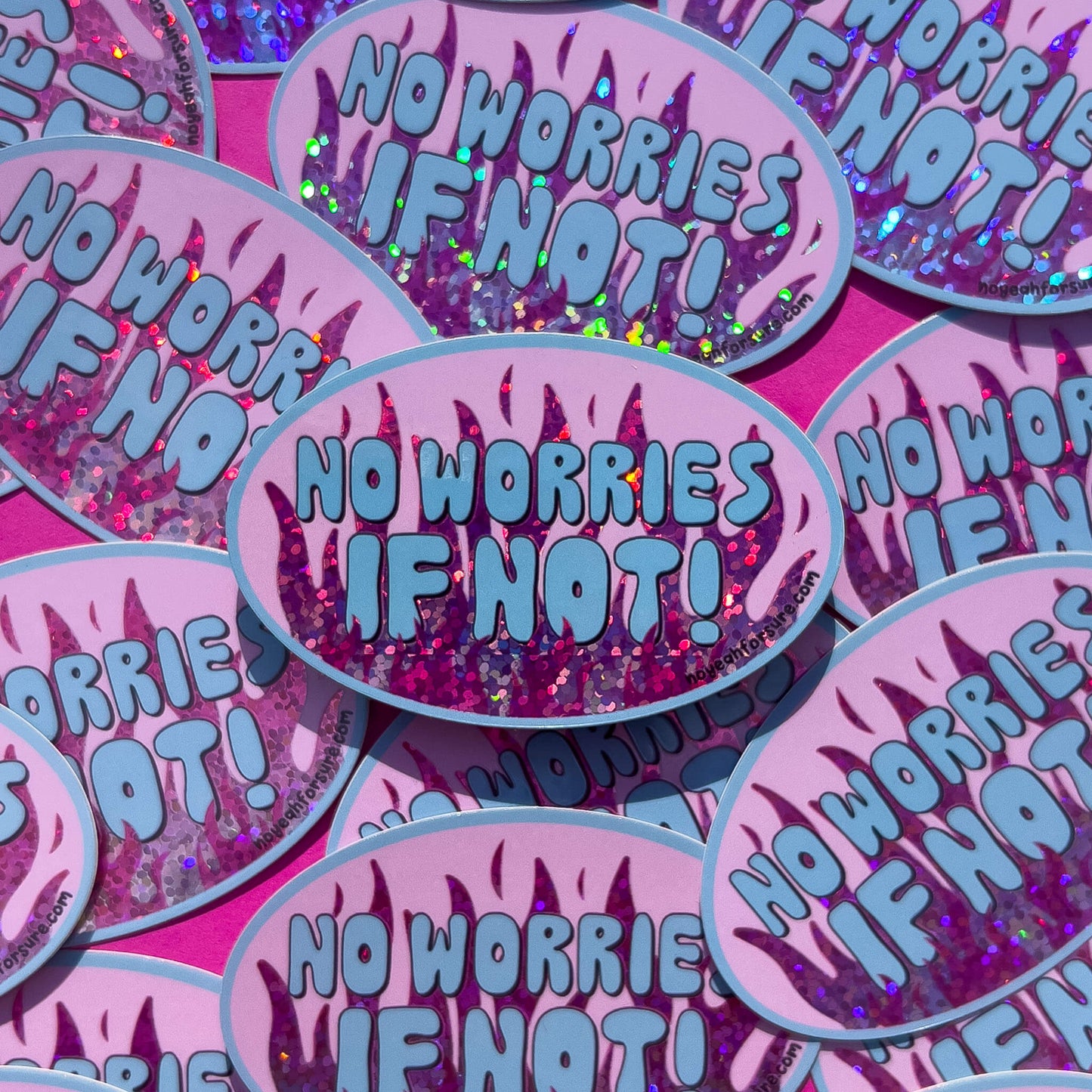 Stickers with 'No Worries If Not!' text on a pink and blue patterned background with pink glitter flames.
