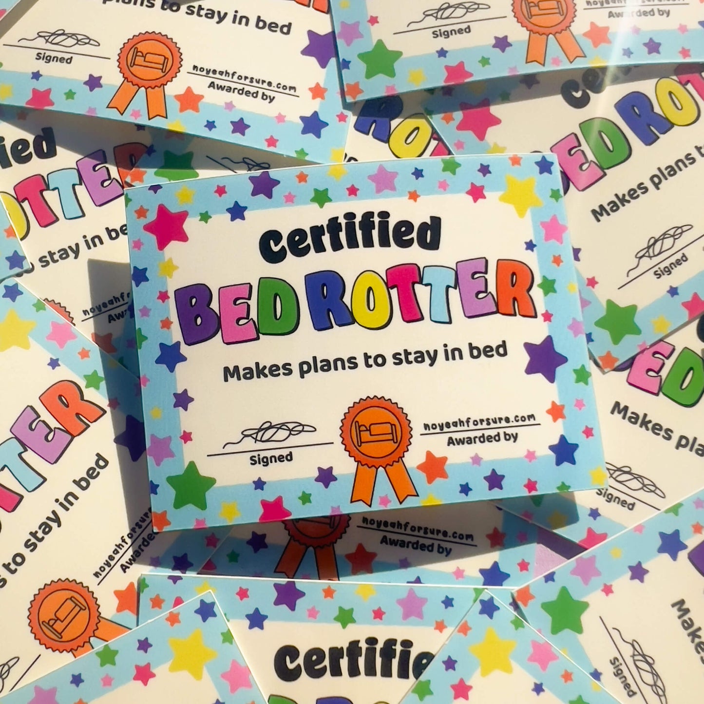 Colorful 'Certified Bed rotter' certificate with stars on a patterned background