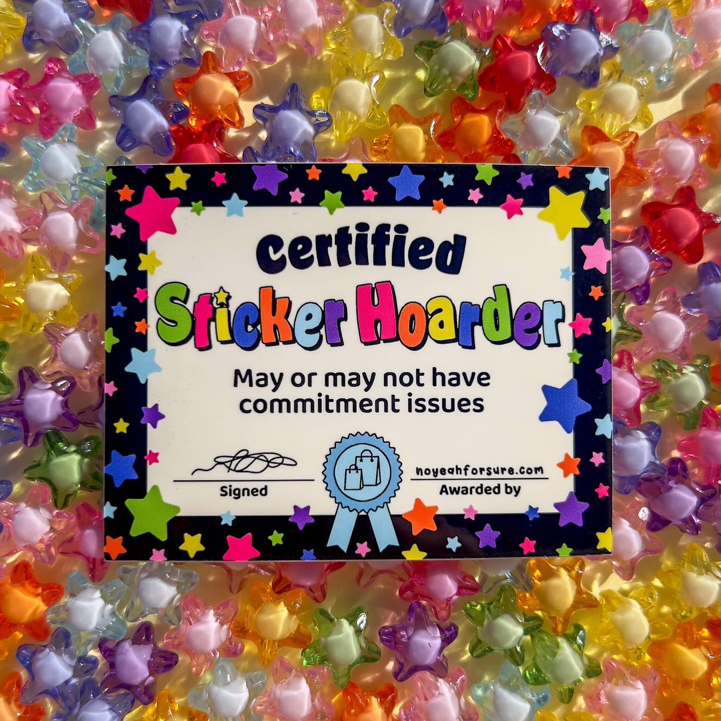 Certified Sticker Hoarder certificate 
surrounded by colorful star-shaped beads.